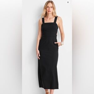 Black midi length dress with slit in back. Dress with pockets!